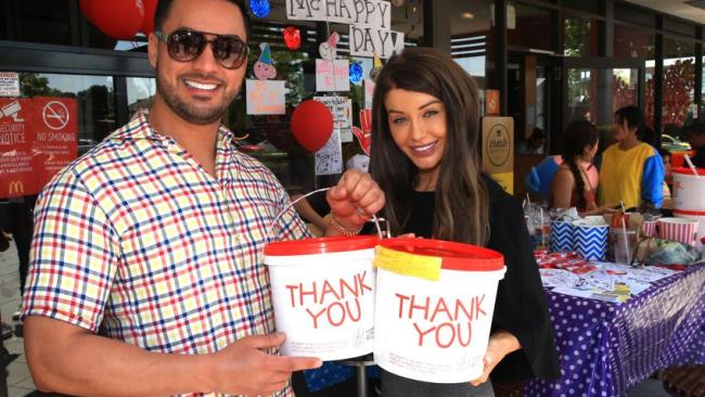 The happy couple raising money at a local fast food outlet. 