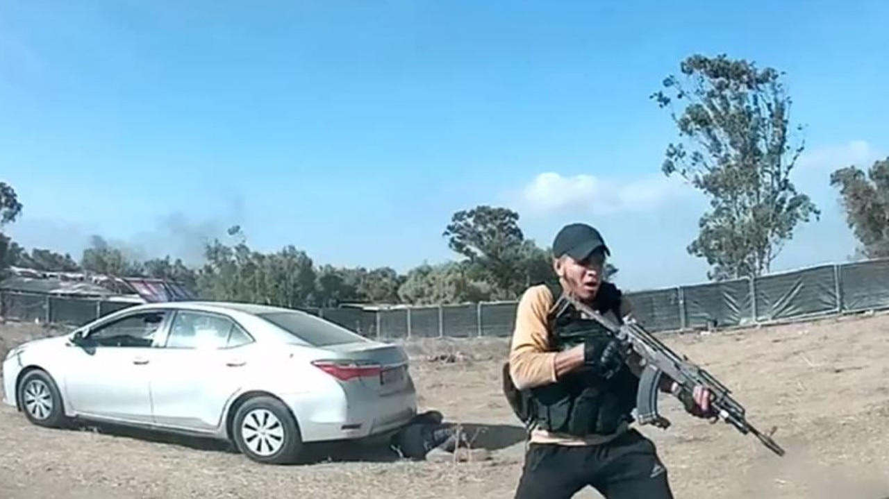 Gun-wielding militants were seen shooting Israeli festivalgoers point-blank before stealing their belongings in horror new dashcam. Picture: Twitter