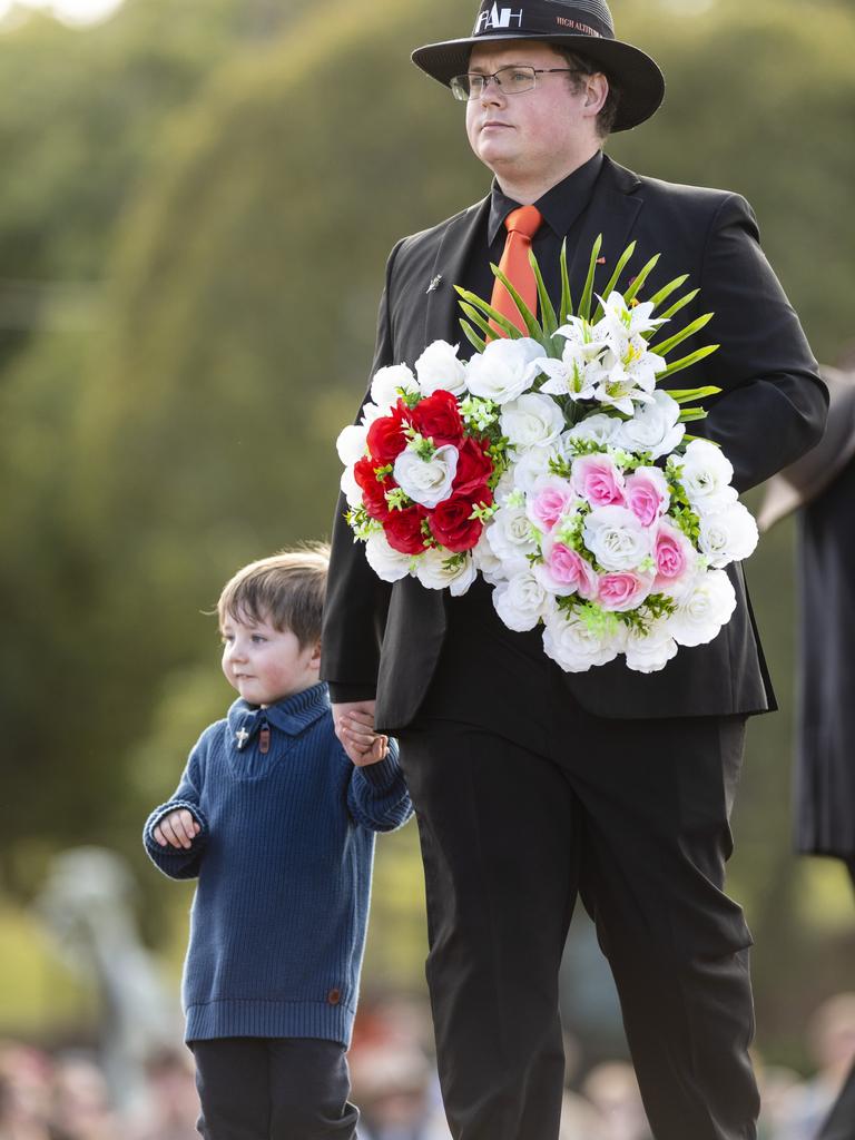 Alistair Ryle and dad Cameron Ryle on behalf of the High Altitude Harmony choir at the Citizens' Wreath Laying Ceremony on Anzac Day at the Mothers' Memorial, Tuesday, April 25, 2023. Picture: Kevin Farmer