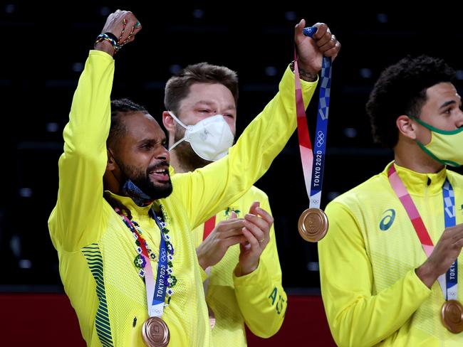 Patty Mills celebrates Australia’s maiden men’s Olympic medal in Tokyo. Picture: Kevin C. Cox/Getty Images