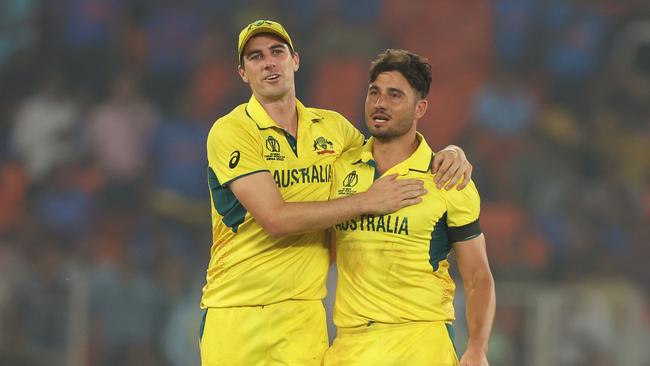 AHMEDABAD, INDIA - NOVEMBER 04: Marcus Stoinis and Pat Cummins of Australia celebrates the wicket of Chris Woakes of England during the ICC Men's Cricket World Cup India 2023 between England and Australia at Narendra Modi Stadium on November 04, 2023 in Ahmedabad, India. (Photo by Robert Cianflone/Getty Images)