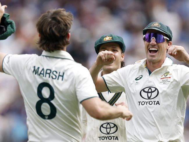 MELBOURNE, AUSTRALIA - DECEMBER 30: Mitchell Marsh of Australia celebrates with teammates after taking a tach to dismiss Rishabh Pant of India during day five of the Men's Fourth Test Match in the series between Australia and India at Melbourne Cricket Ground on December 30, 2024 in Melbourne, Australia. (Photo by Daniel Pockett - CA/Cricket Australia via Getty Images)