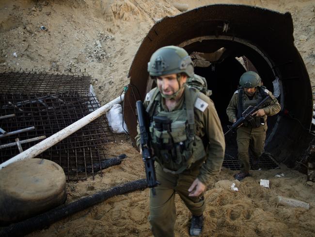 Israeli soldiers exit a tunnel near the border with Israel. Picture: Getty Images.