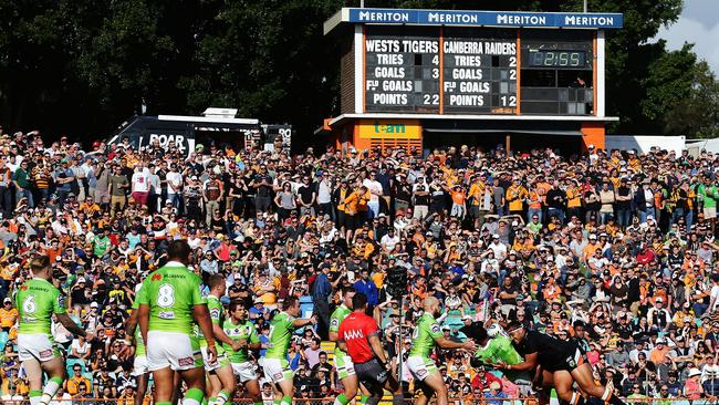 A large crowd watches the action, in which the Raiders proved too good.