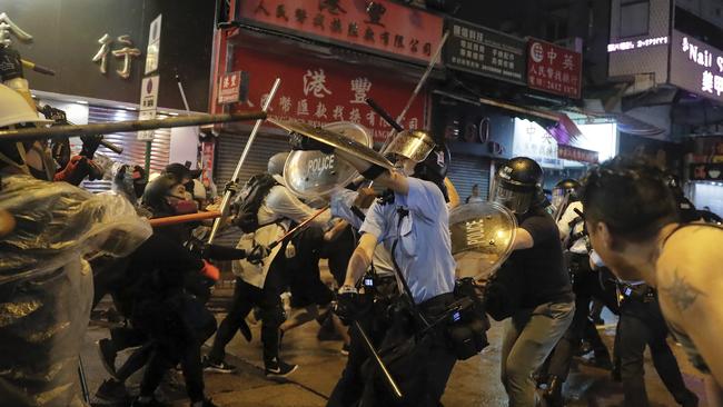 Police clash with demonstrators on a street during a protest in Hong Kong. Picture: AP