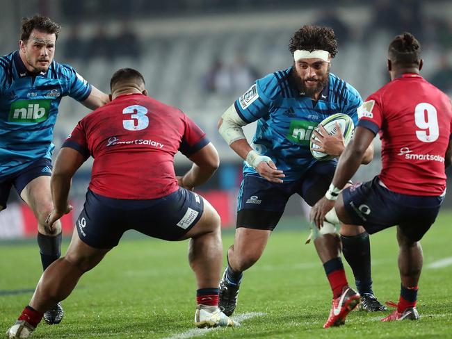 Blues Alex Hodgman (C) looks for a gap in the Reds defence. Pic: Getty