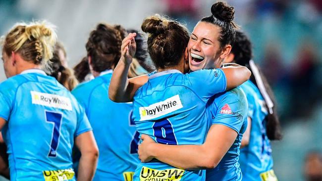 NSW players celebrate their Super W grand final win.