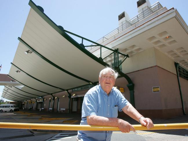 Bruce Bishop in front of the Surfers Paradise Transit Centre and the carpark that was named after him.