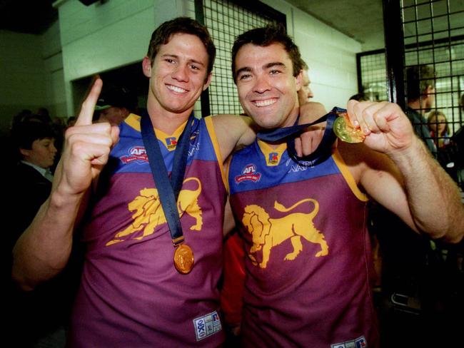 28/09/2002. Aaron Shattock and Chris Scott with their Premiership medals. 2002 Grand Final. Brisbane Lions v Collingwood. MCG.