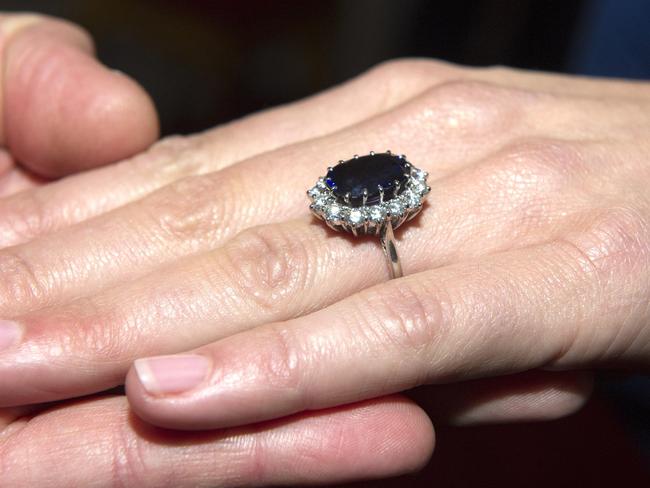 Prince William holds Kate Middleton’s hand, bearing the engagement ring that once belonged to Diana, Princess of Wales. Picture: AP Photo/Arthur Edwards