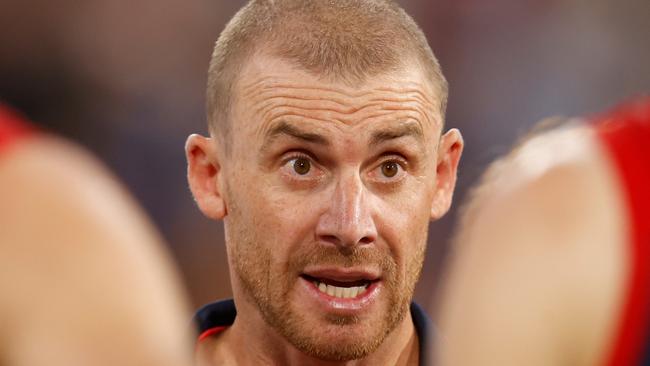 MELBOURNE, AUSTRALIA - MARCH 16: Simon Goodwin, Senior Coach of the Demons addresses his players during the 2022 AFL Round 01 match between the Melbourne Demons and the Western Bulldogs at the Melbourne Cricket Ground on March 16, 2022 In Melbourne, Australia. (Photo by Michael Willson/AFL Photos via Getty Images)