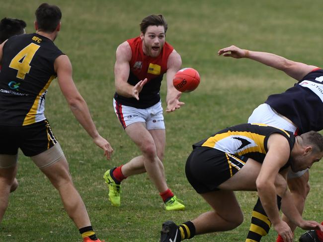 Tim Jones receives a handball. Picture: James Ross/AAP