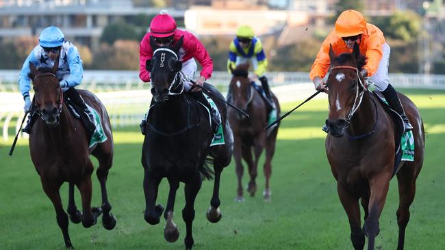 Tyler Schiller and Spione (right) sail down the outside to score at Randwick. Picture: Getty Images