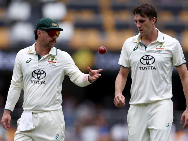 Australia's Test vice captain Travis Head and captain Pat Cummins at the Gabba. Picture: David GRAY / AFP