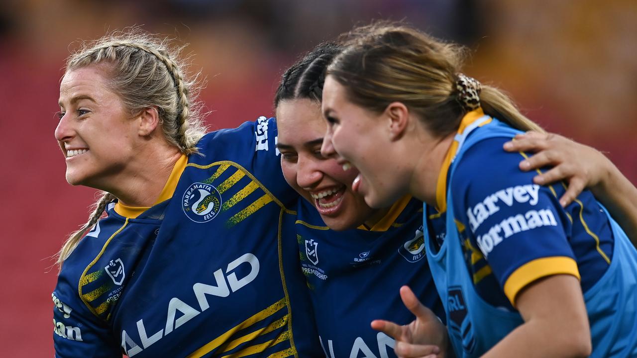 BRISBANE, AUSTRALIA - SEPTEMBER 25: Tayla Preston, Rima Butler and Ruby-Jean Kennard of the Eels celebrate victory during the NRLW Semi Final match between the Sydney Roosters and the Parramatta Eels at Suncorp Stadium on September 25, 2022 in Brisbane, Australia. (Photo by Albert Perez/Getty Images)
