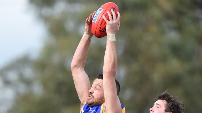 Jesse Dunne flies for a mark. Picture: Lawrence Pinder