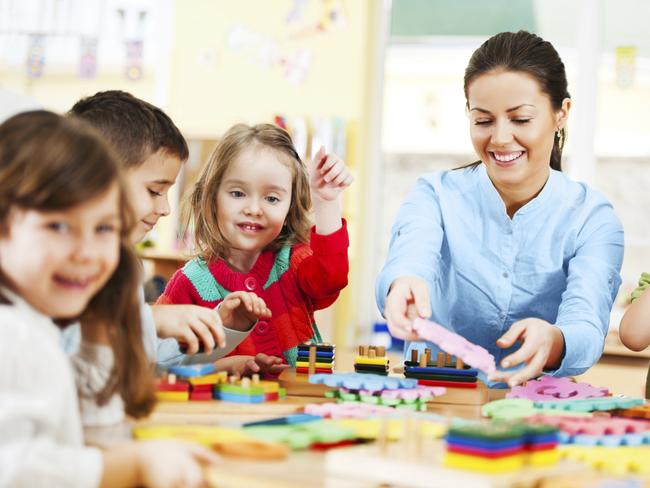 Generic photo of a childcare worker and children in a daycare centre