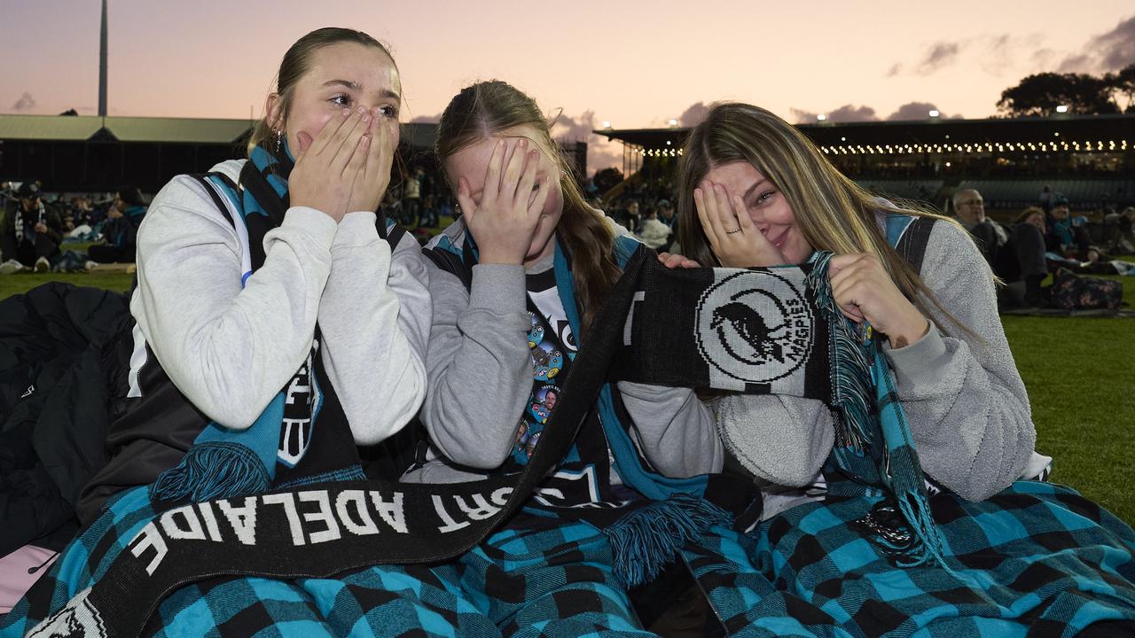 Tash Dodd, 18, Grace Taylor, 14, and Sienna Madigan, 15 at Alberton Oval, during the Port Adelaide loss. Picture: Matt Loxton