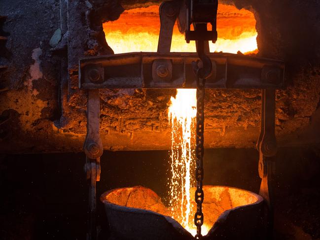 Molten liquid copper is poured from a furnace at a copper refinery in Norilsk, Russia. Photographer: Andrey Rudakov/Bloomberg