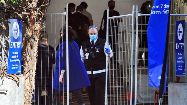 People queue outside the Alfred Hospital in Melbourne to be tested for COVID-19. Picture: Aaron Francis/The Australian