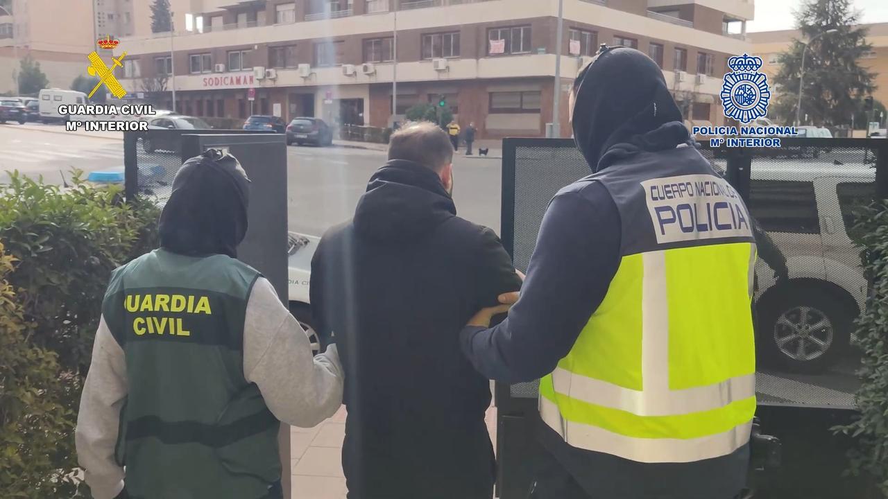 Spain’s Guardia Civil with one of the members the Comanchero bikie gang in March last year. Picture: Supplied