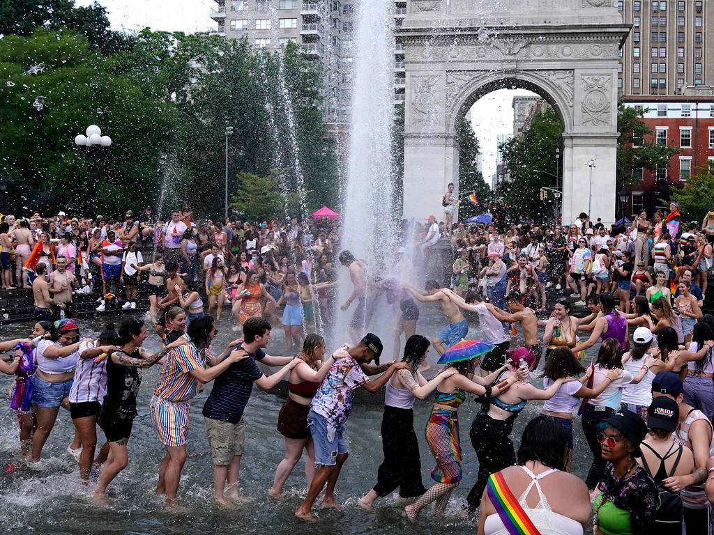 Meanwhile, in New York City where more than 60 per cent of the population is vaccinated, people dance in the Washington Square Fountain on June 27, 2021. Picture: Timothy A Clary/AFP.