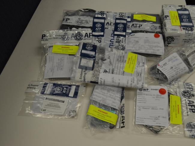 Devices seized in the arrest of Wyong man Justin Radford, 29, in February 2020 as part of an Australian Federal Police investigation into an alleged child sex abuse ring. Picture: AFP