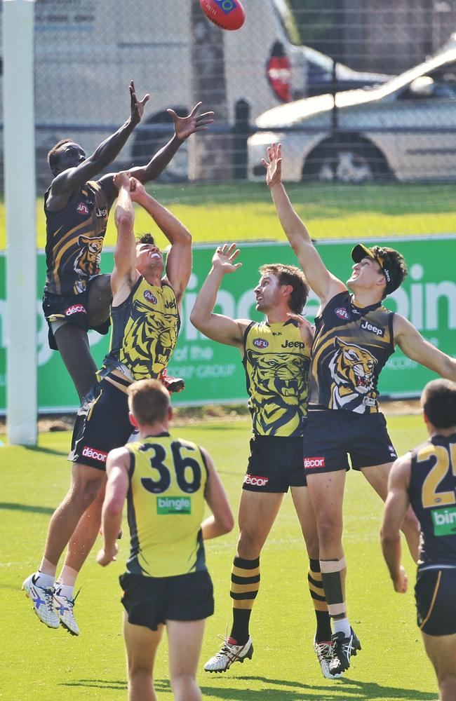 Mabior Chol flies high over Alex Rance during an intra-club match. Picture: Hamish Blair