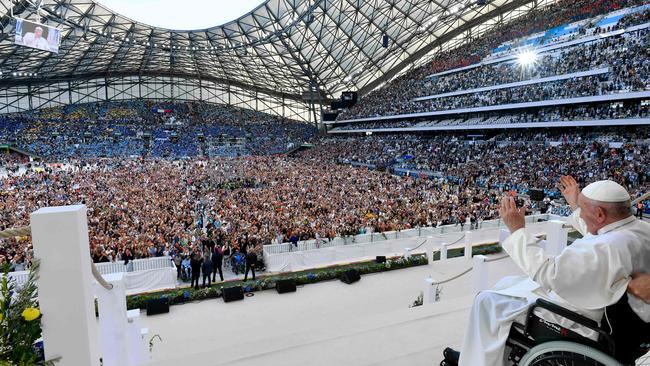 Pope Francis, aged 86, waves to the crowd during a holy mass at the packed out Velodrome stadium in Marseille, France. Picture: Vatican Media/AFP