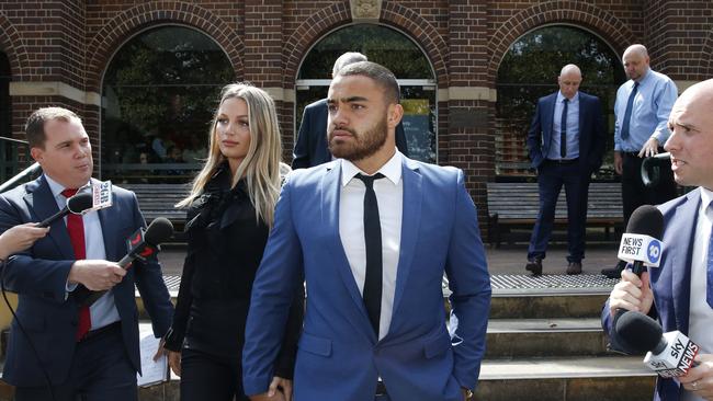 Dylan Walker leaves Manly Local Court with his fiancee, Alexandra Ivkovic.