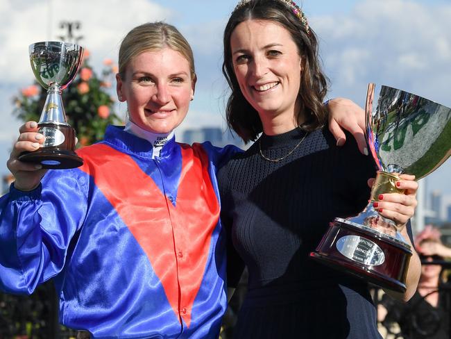 Jamie Kah with her good friend Annabel Neasham after winning the TAB Champions Stakes at Flemington. Picture: Morgan Hancock/Racing Photos