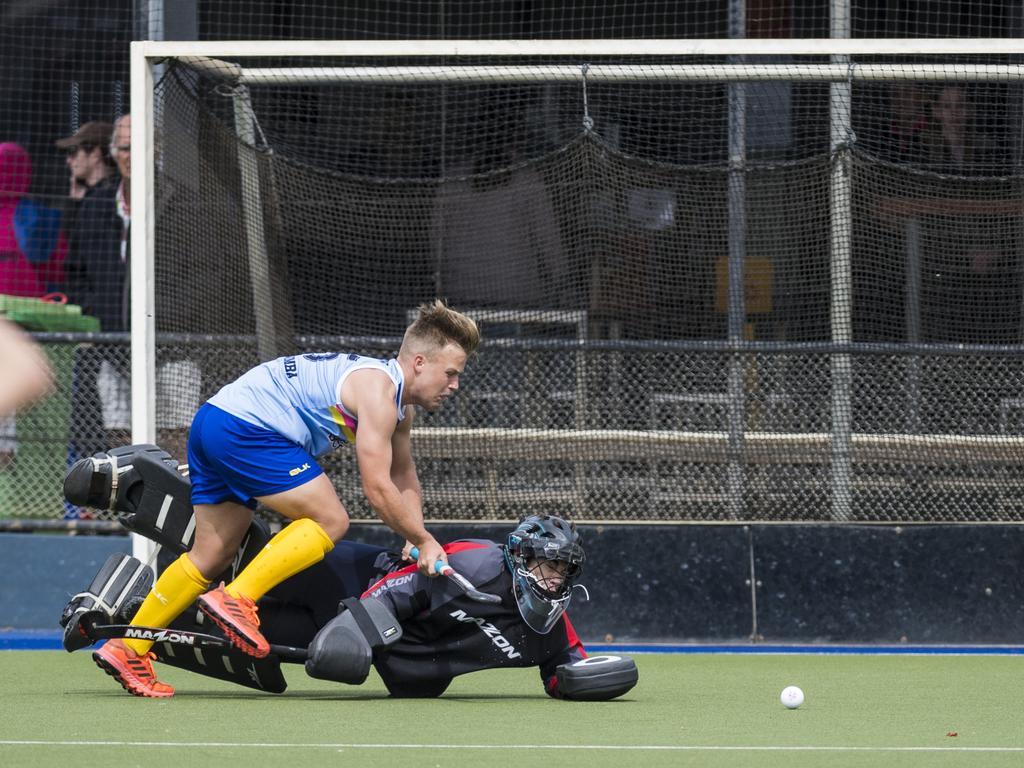 Toowoomba 1 player Carter Mogg and Sunshine Coast keeper Adam Owers in Hockey Queensland Championships at Clyde Park, Sunday, May 2, 2021. Picture: Kevin Farmer