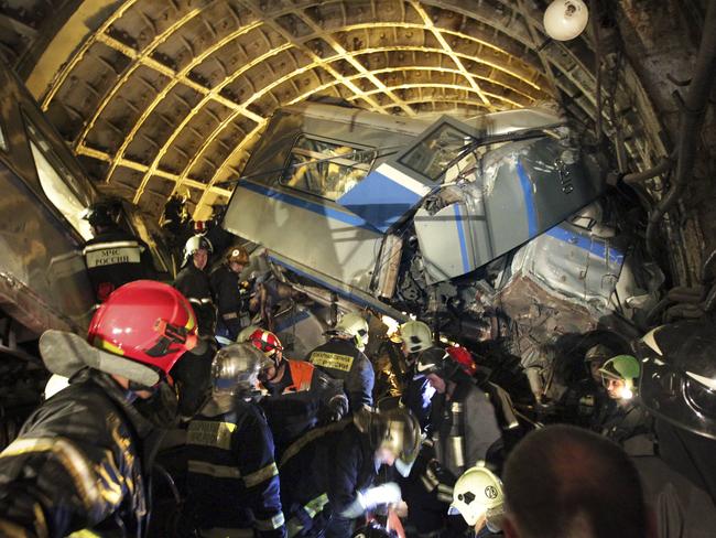 Rescuers work in a tunnel after a train derailed between two subway stations in Moscow, Russia.