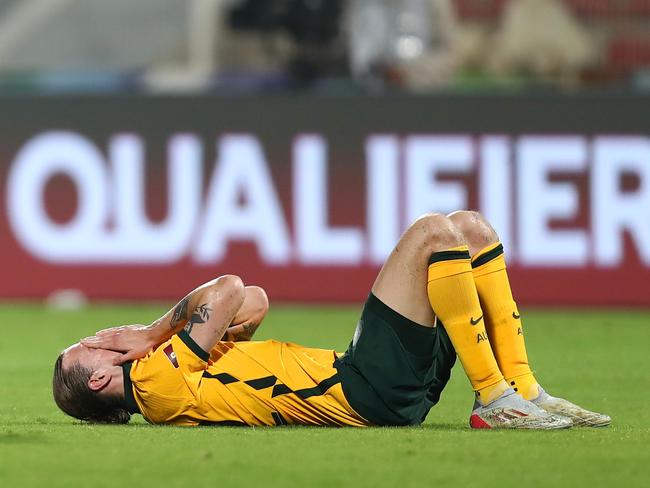 MUSCAT, OMAN - FEBRUARY 01: Jackson Irvine of Australia looks dejected following their draw in the FIFA World Cup Qatar 2022 Qualifier match between Oman and Australia at Sultan Qaboos Sports Complex on February 01, 2022 in Muscat, Oman. (Photo by Adil Al Naimi/Getty Images)