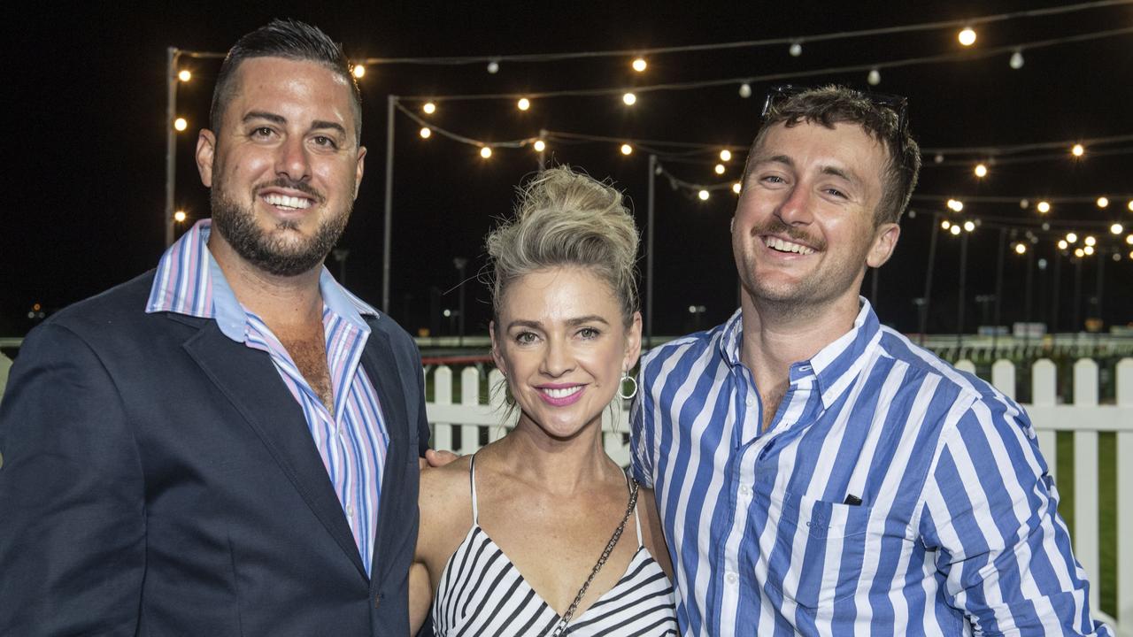 (from left) Liam Khan, Sarah Cranitch and Jack Daly. New Year's eve at King of the Mountain race day, Clifford Park race course. Saturday, December 31, 2022. Picture: Nev Madsen.