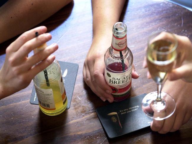 Hands of women holding alcholic drinks.woman alcohol human relations /Drinking