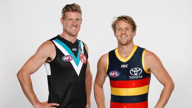 MELBOURNE, AUSTRALIA - MARCH 10: Tom Jonas of the Power and Rory Sloane of the Crows pose during the 2020 AFL Captains Day at Marvel Stadium on March 10, 2020 in Melbourne, Australia. (Photo by Dylan Burns/AFL Photos)