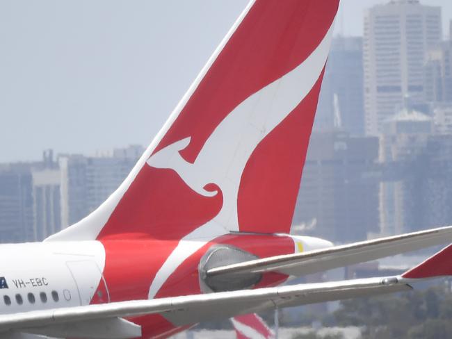 Qantas aircraft are seen at Sydney Airport, Thursday, 24 December 2020. Authorities are urgently investigating how a Qantas crew member contracted Covid-19 after arriving in Darwin from Paris and then flying to Sydney without being tested or quarantined. Federal health authorities are working with Qantas to understand how the man, who landed in Darwin on 17 December after working on a repatriation flight from Paris, became infected. Picture - Sam Mooy/The Australian Newspaper