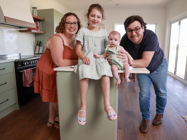 Matt Hatton and Erin Riley with their children at their newly built home. Picture: Justin Lloyd.