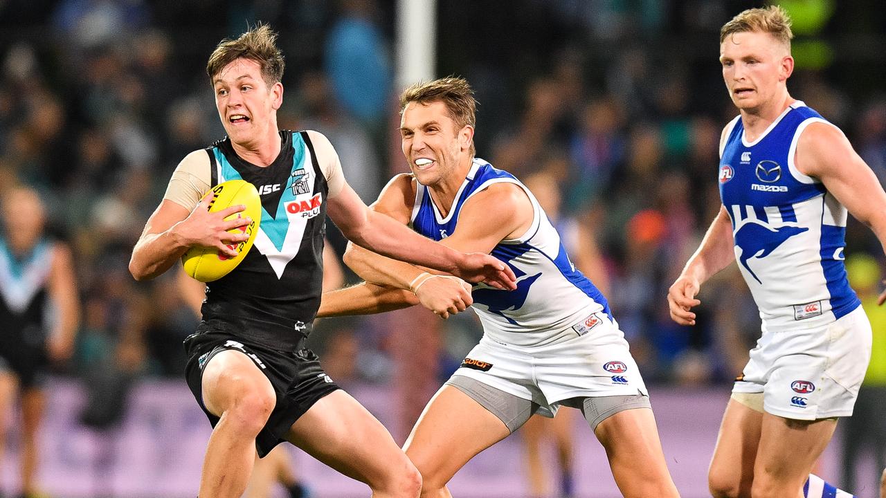 Zak Butters of the Power breaks a tackle during the win over North Melbourne at Adelaide Oval. Picture: Daniel Kalisz/Getty Images