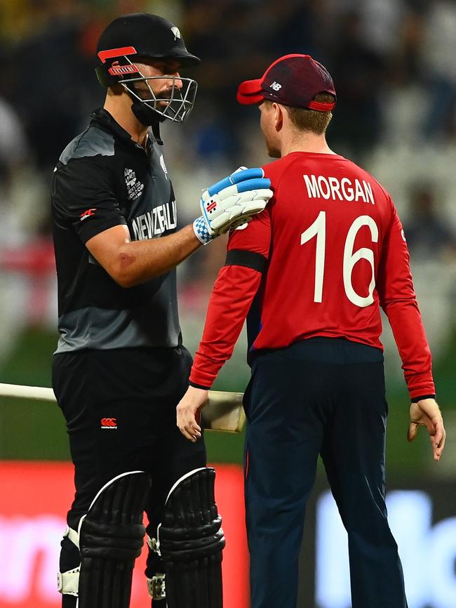 Daryl Mitchell of New Zealand consoles England’s Eoin Morgan after the teams’ T20 World Cup semi-final. Picture: Getty Images