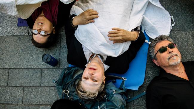 Unlike more graphic die-in protests overseas, South Australia’s climate rebels came with white sheets and blankets rather than buckets of fake blood. Picture: AAP Image/ Morgan Sette