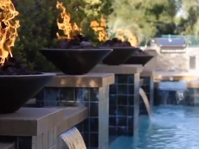 Another view of the pool and outdoor barbecue.