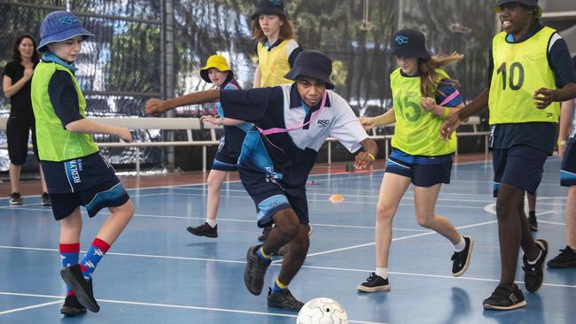 Queensland's Activate Inclusion Sports Day at Redlynch Central Sports Stadium. Redlynch State College student Hendrix Bing (centre) breaks towards goal during specialised coaching by Football Queensland at the Spoorts Day. Picture: Brian Cassey