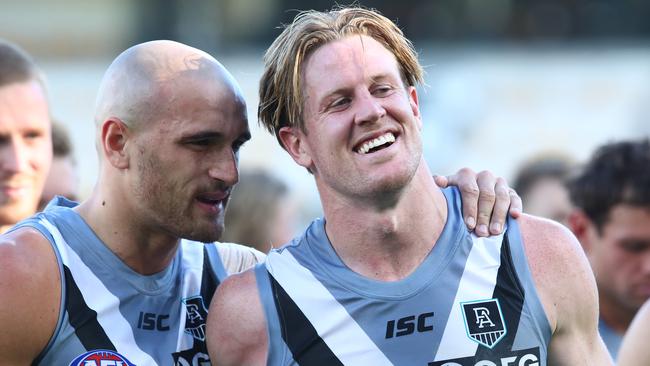 Port Adelaide’s Sam Powell-Pepper and Tom Jonas celebrate the win over Carlton. Picture Jono Searle/AFL Photos/via Getty Images