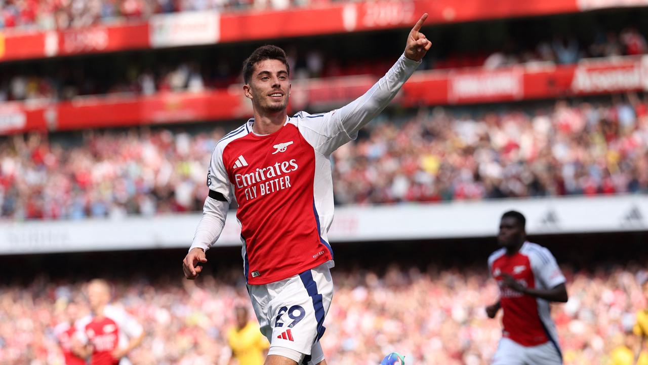 TOPSHOT – Arsenal's German midfielder #29 Kai Havertz celebrates scoring the opening goal of the English Premier League football match between Arsenal and Wolverhampton Wanderers at the Emirates Stadium in London on August 17, 2024. (Photo by Adrian DENNIS / AFP) / RESTRICTED TO EDITORIAL USE. No use with unauthorised audio, video, data, fixture lists, club/league logos or 'live' services. Online in-match use limited to 120 images. An additional 40 images may be used in extra time. No video emulation. Social media in-match use limited to 120 images. An additional 40 images may be used in extra time. No use in betting publications, games or single club/league/player publications. /