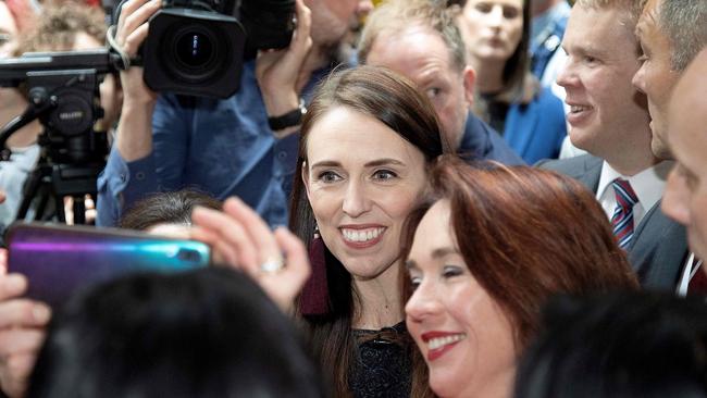 Jacinda Ardern poses for photos with students while campaigning at Victoria University in Wellington this week. Picture: AFP