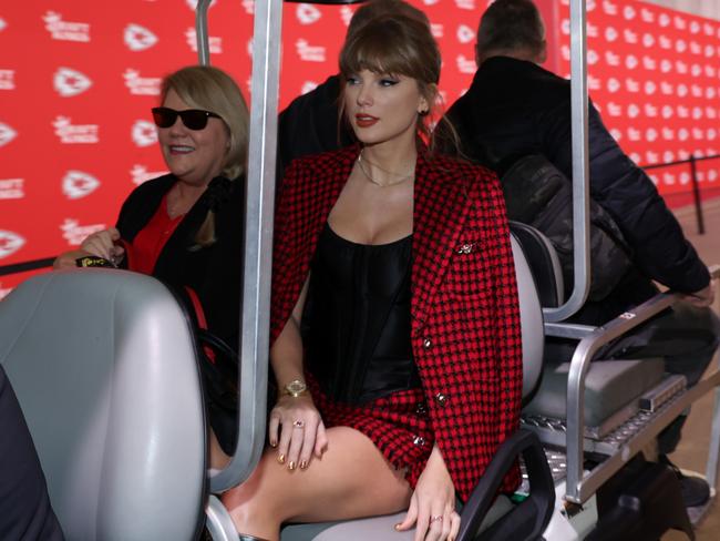 KANSAS CITY, MISSOURI - NOVEMBER 10: Taylor Swift rides on a golf cart prior to a game between the Kansas City Chiefs and the Denver Broncos at GEHA Field at Arrowhead Stadium on November 10, 2024 in Kansas City, Missouri. (Photo by Jamie Squire/Getty Images)