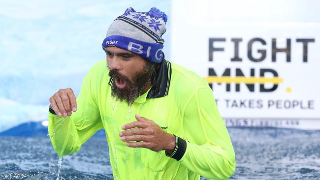 Cyril Rioli hits the ice slide at the MCG to help raise awareness for the fight against MND. Picture: Michael Klein