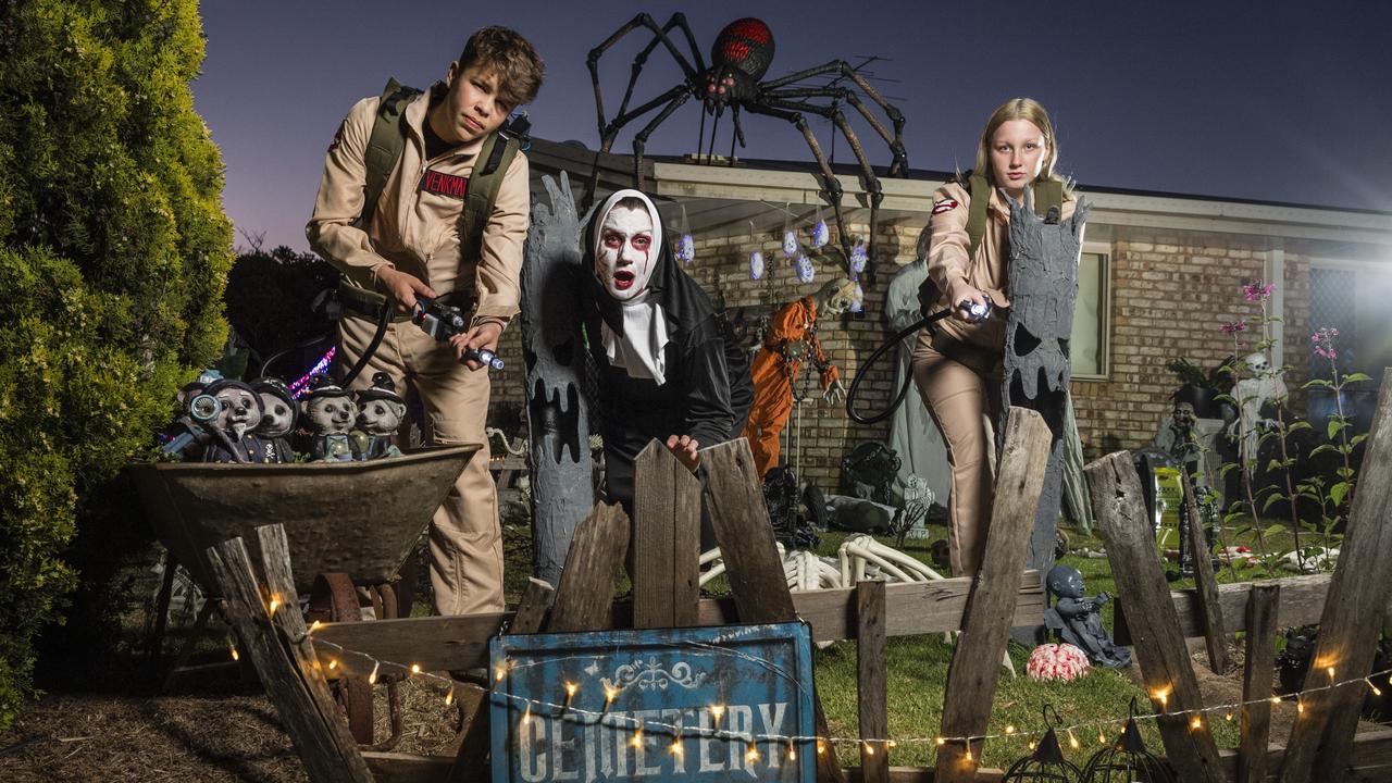 Ready for Halloween are (from left) Anrich Prinsloo, Jo Philp and Isabell Philp at the Philp family scare house in Cranley, Friday, October 13, 2023. Picture: Kevin Farmer